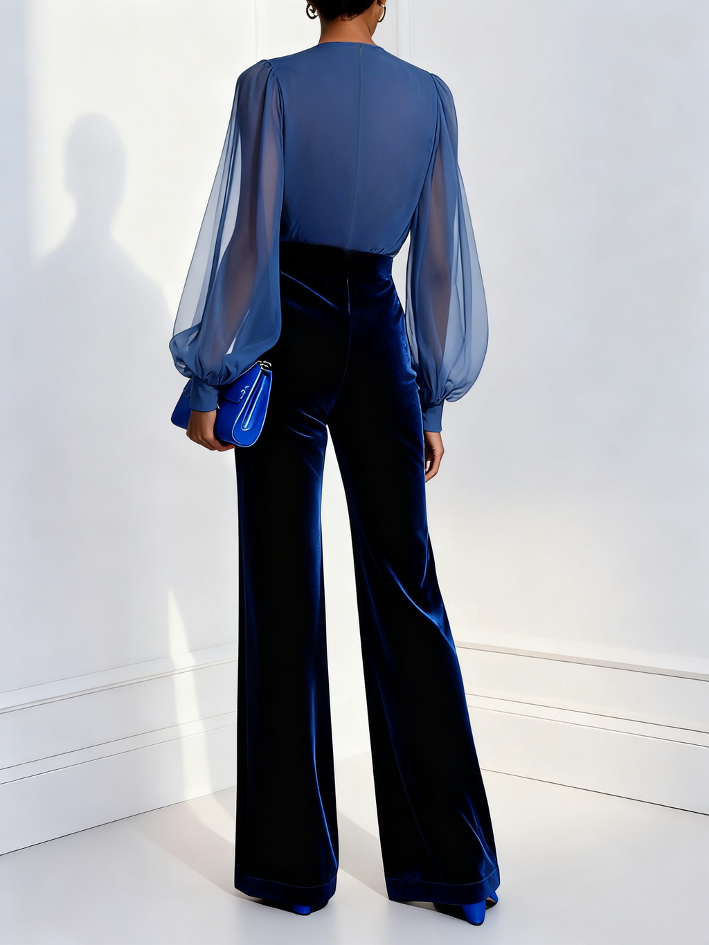 Jumpsuit in velluto blu con scollo a V e maniche lunghe