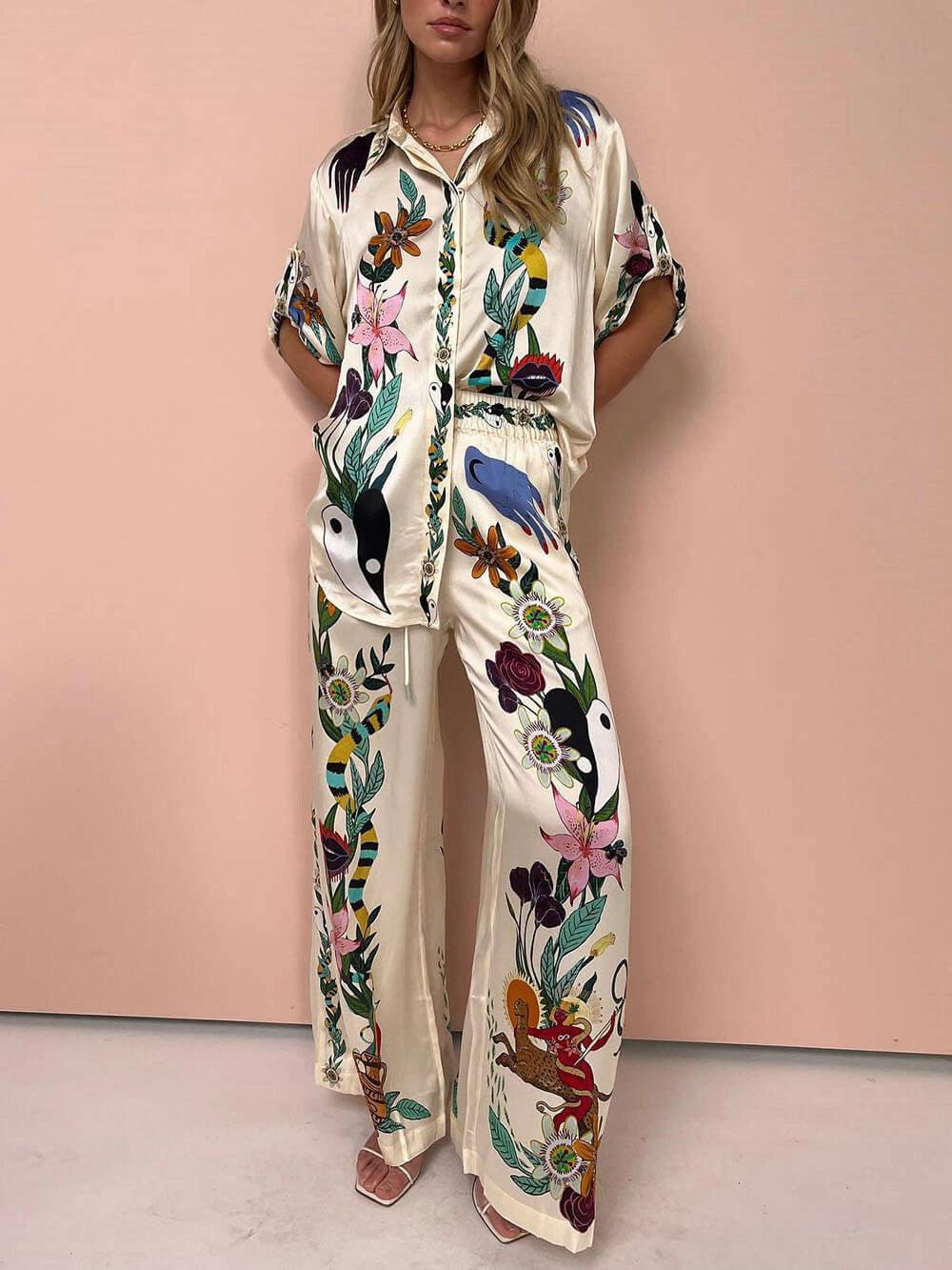 Nika | Set di camicia e pantaloni in satin con stampa unica Vibes Resort